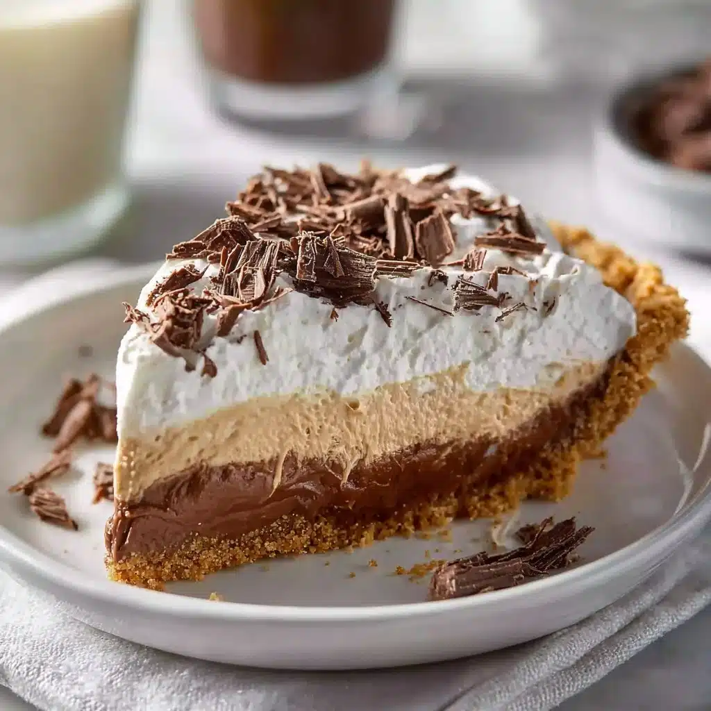 No-Bake Cream Cheese Peanut Butter Pie topped with chocolate whipped cream