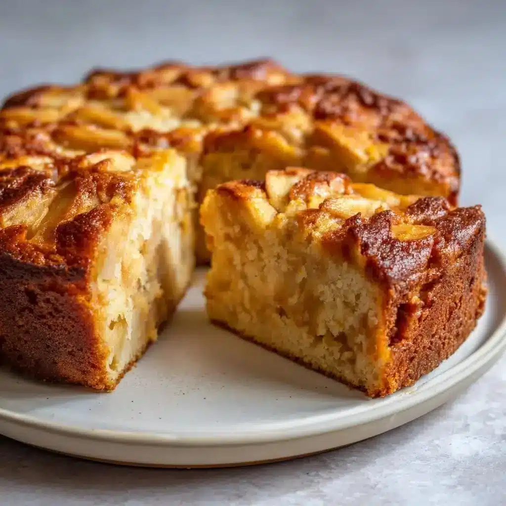 Moist and sweet sourdough apple cake served with a slice of apple on top